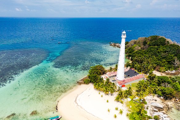 Belitung beach and islands with its storybook Lengkuas Island lighthouse.