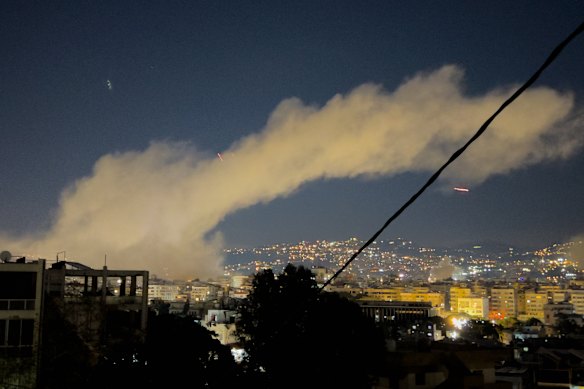 Smoke rises from Israeli airstrikes on Dahiyeh, a southern suburb of Beirut, early Monday.