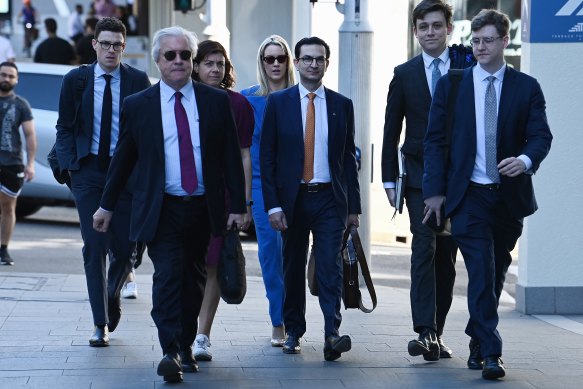 Surgeon Munjed Al Muderis (centre) with his legal team.