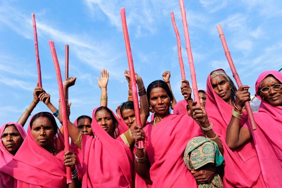 The sari as political statement: women from The Gulabi Gang who fight violence against women, wear pink saris.