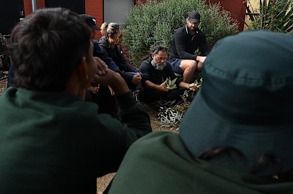 Lucho Valeo teaches Indigenous cultural skills to the young people.