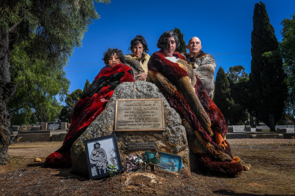 Waywurru people (left to right) Shaniece Smith, Liz Thorpe, Jalina Smith and Thorn Smith at a memorial to Mary Jane Milawa in the Wangaratta Cemetery paid for by Fred Dowling and his family. The plaque identifies Milawa as "the last member of the Pangerang tribe".