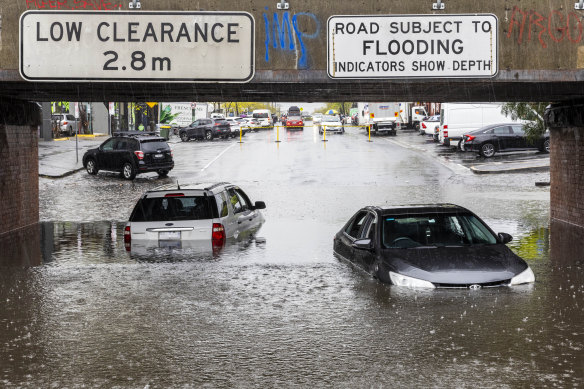 Cars submerged in floodwater at the York Street underpass in South Melbourne. 