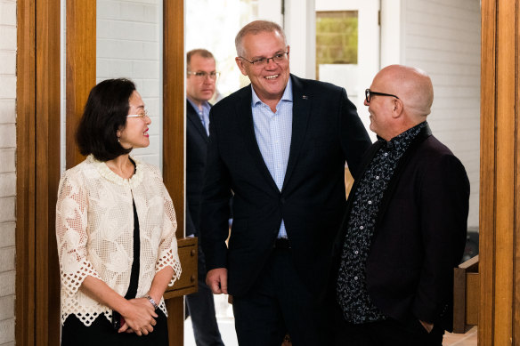 Prime Minister Scott Morrison visits a Good Friday service at Syndal Baptist Church, pictured here with local member Gladys Liu and senior pastor Chris Danes. 