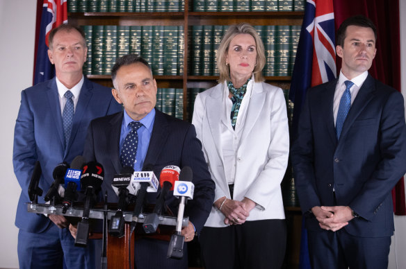 Opposition Leader John Pesutto (second from left) and Matt Bach (right) at a press conference regarding Moira Deeming in 2023.