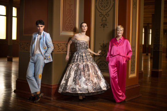 Caroline Ralphsmith poses ahead of the launch of this year’s launch of the  Melbourne Fashion Festival (wearing Sydney label Michael Lo Sordo) with models Jay Coolahan (wearing Reigner) and Clare Walker (wearing Paul McCann).