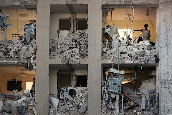 A man look at debris in their apartment that has been caught by an iranian ballistic missile in beersheba on Tuesday.
