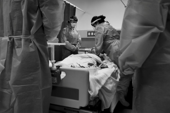 Practising chest compressions on a training dummy called Corey Virus.