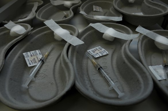 Trays holding needles and swabs in preparation for the AstraZeneca COVID-19 vaccinations at Tharawal Corporation Medical Centre in Airds, in Sydney.
