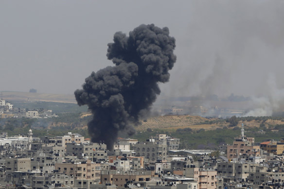 Smoke rises after an Israeli air strike in Gaza on Tuesday.
