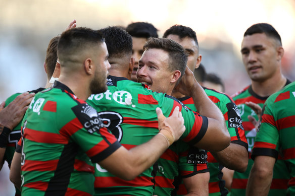 South Sydney celebrate Damien Cook's try in the rout over Newcastle.
