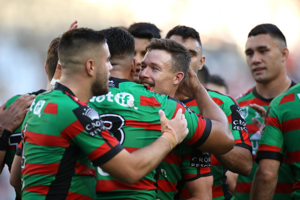 South Sydney celebrate Damien Cook's try in the rout over Newcastle.