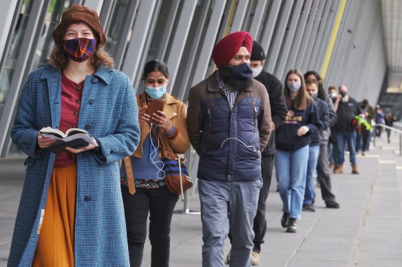 People waiting to get vaccinated at the Melbourne Convention Centre on Friday. 