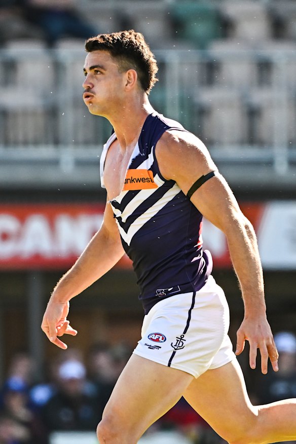 Patrick Voss plays on with a ripped jumper.