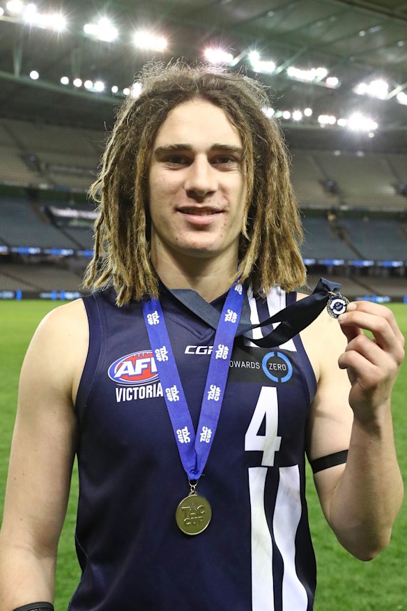 Gryan Miers with his Geelong Falcons TAC Cup premiership medallion in 2017.
