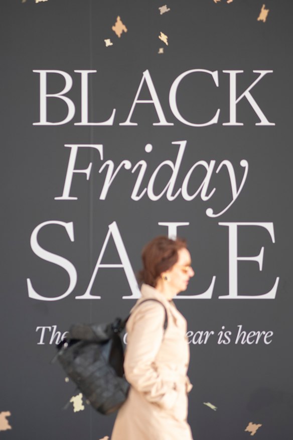 Shoppers walk past a Black Friday sign at David Jones, Melbourne, in 2023: Black Friday is getting bigger every year.
