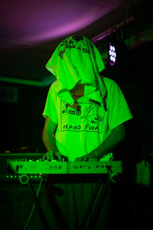 Shirts and synths: People gather at Petersham Bowling Club’s gig basement, as Demolition Man performs before an Olivia’s World gig that SydneyMusic.Net listed on its weekly guides.