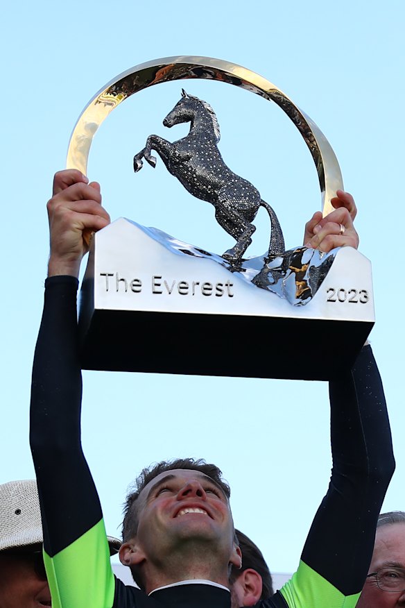Sam Clipperton hoists The Everest trophy high.