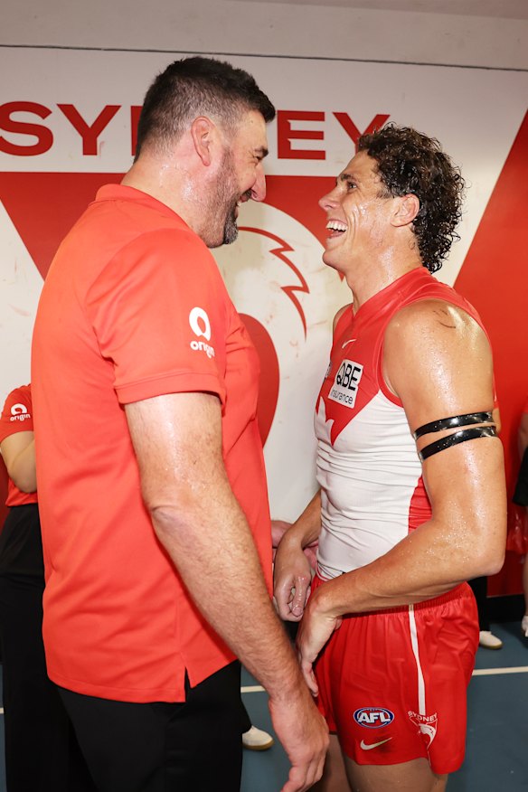 Swans coach Dean Cox and spearhead Charlie Curnow share a laugh after the game.