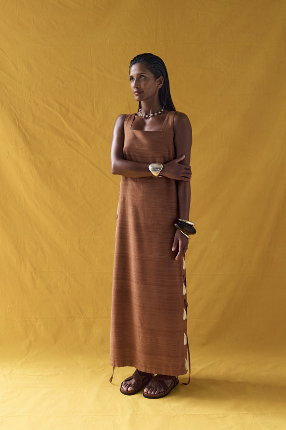 Lucy Folk “Ritual” silk dress, $1400. Agmes “Giselle” silver cuff, $2300.