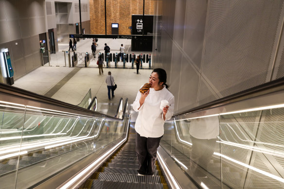 Frances Song, co-owner of Moon Phase bakery at St Leonards, with one of her chocolate bar croissants at nearby Crows Nest Metro station.