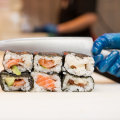 Sushi Hub staff preparing sushi rolls for the lunch rush. 