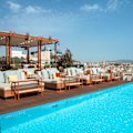 The rooftop infinity pool overlooks the city’s Old Town.