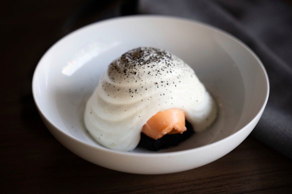 The carrot sorbet with yoghurt mousse and licorice cake is one of Cafe Paci’s signature dishes. 