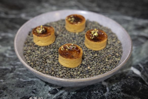 A chef at Vow’s factory in Alexandria has prepared a dish made of a pastry shell, Forged Parfait and a brulee topping.
