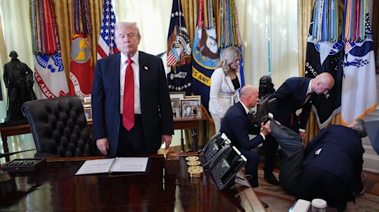 A photo of Donald Trump appearing to ignore the plight of a man who collapsed has caught plenty of attention.
