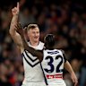 MELBOURNE, AUSTRALIA - AUGUST 24: Josh Treacy of the Dockers is congratulated by Michael Frederick after kicking a goal during the round 24 AFL match between Western Bulldogs and Fremantle Dockers at Marvel Stadium on August 24, 2025 in Melbourne, Australia. (Photo by Robert Cianflone/Getty Images)