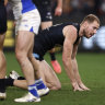 Carlton’s Harry McKay on all fours after copping a knock in the third quarter against North Melbourne.