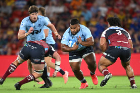 Taniela Tupou of the Waratahs takes on the defence