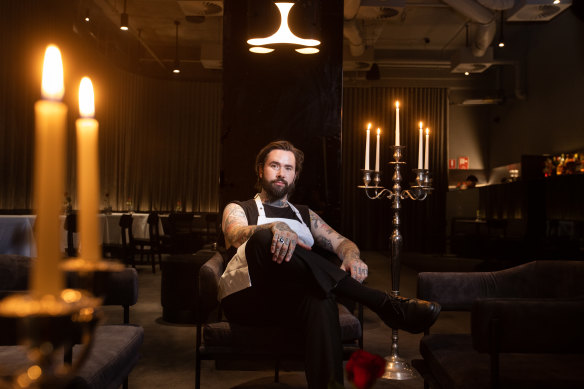 Purple Pit co-owner Joe Jones in the softly lit underground bar.