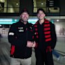 Essendon fan Christopher Klose with his son Jordan outside the MCG.