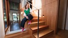rchitect Charly Watson at the Waverley House, which she helped transform into a split-level family home defined by its central staircase.