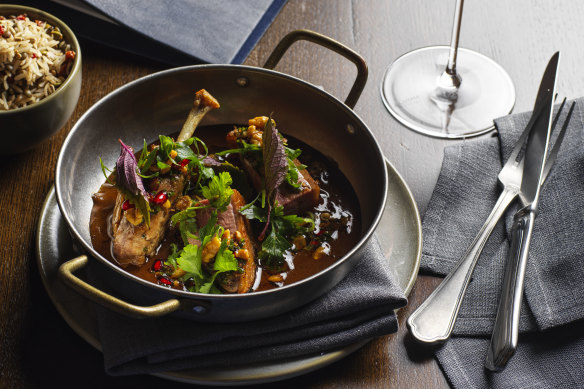 Roast duck fesunjun with butter-roasted walnuts, pomegranate and fragrant herbs.