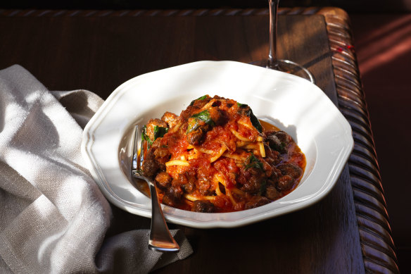 Home-made egg spaghetti with tiny meatballs and traditional Abruzzese meatball sugo.