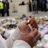 A floral memorial is growing daily near the scene of the shooting at Bondi.