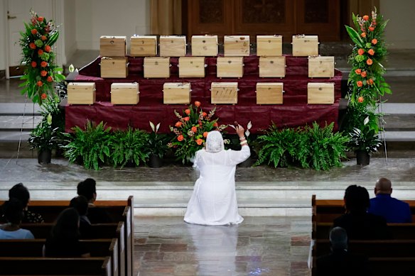 Nana Sula “Janet” Evans blesses the remains of 19 African Americans repatriated from Germany during their memorial service at Dillard University’s Lawless Memorial Chapel in New Orleans.