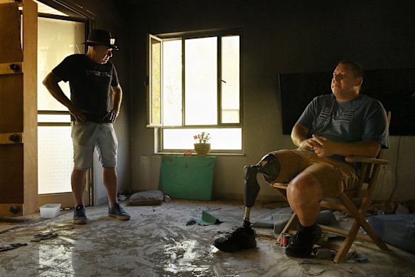 Survivors of the October 7 Hamas attack Australian Israeli Geoffrey “Danny” Majzner, 62, (left) and Avida Bahar in Avida’s home in Kibbutz Be’eri, Israel, which is near the Gaza border. Majzner’s sister Galit Carbone was killed by Hamas as was Bahar’s wife, Dana, and son, Carmel. Bahar lost his right leg after being shot by Hamas. His daughter Hadar was also wounded.