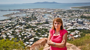 Townsville Mayor Jenny Hill on top of Castle Hill  with Townsville in the background.