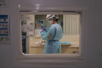 A nurse works in a COVID-19 unit at Mission Hospital in California. 