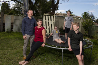 Lew and Holly Usher and their children Claire, 9, Nathan, 11 and Rowan, 13 at their Dundas home.