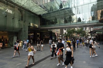 People attend the Boxing day sales in Sydney’s CBD despite NSW recording 6394 COVID-19 cases.