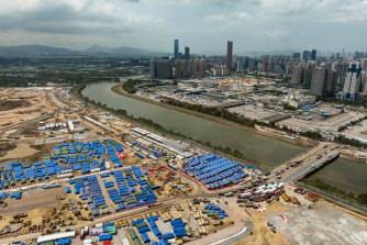 A temporary isolation facility to house COVID-19 patients being built next to a temporary bridge linking Shenzhen and Lok Ma Chau over the Shenzhen River, separating Hong Kong from the Chinese mainland.
