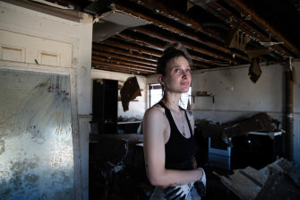 Emily Chave is overwhelmed by the destruction of her home in Woodburn - which she renovated herself - as she enters it for the first time.