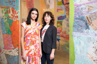 Designer Lisa Gorman in 2019, with model Domanique Hutchins wearing a dress with artwork from Mangkaja Artists.