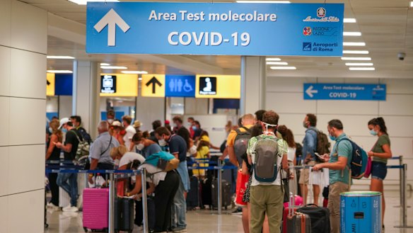 Travellers arrive at Rome's Leonardo da Vinci airport to be tested for the coronavirus as per a new rule imposed last week.
