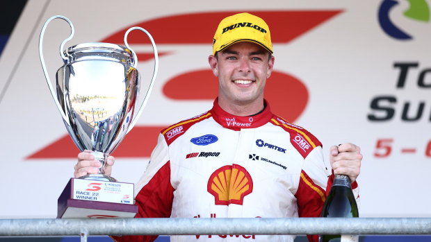 Scott McLaughlin driver of the #17 Shell V-Power Racing Team Ford Mustang celebrates his win after race 22 during the Townsville SuperSprint